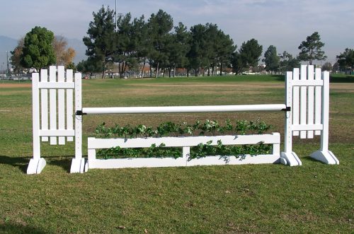 brush box in white with slant picket jump