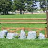 cedar split rail fence with log wings and rock set