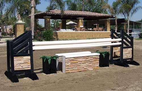 Travertine wall with matching black standards