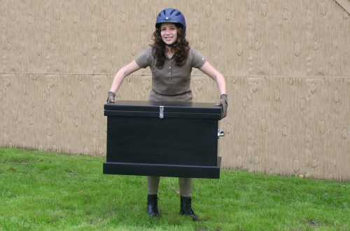 young lady holding a black starter trunk